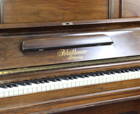 An early 20th century Bluthner rosewood cased upright piano,